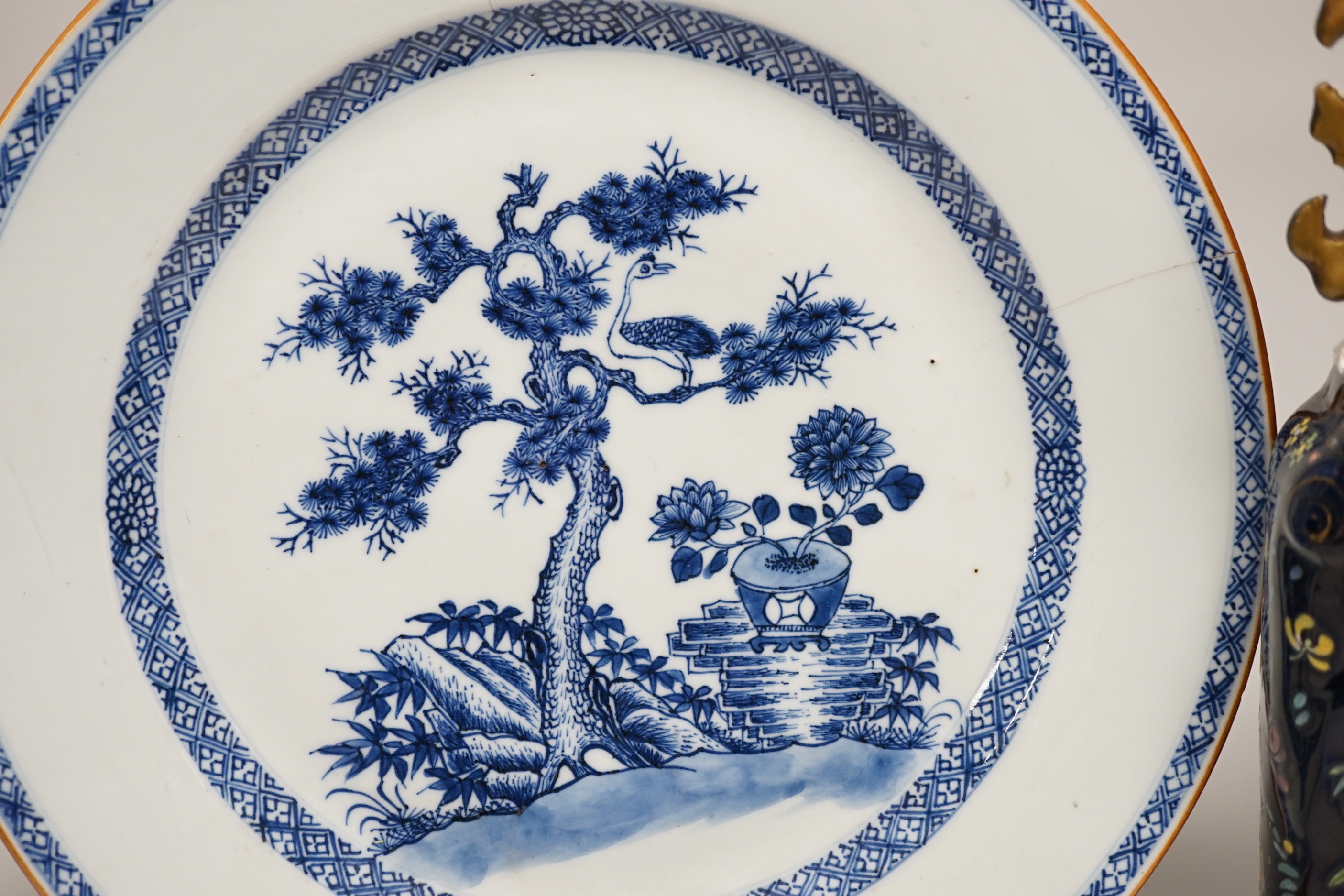 An 18th century Chinese export blue and white charger, a similar soup bowl and a late 19th century enamelled blue ground vase, 32cm